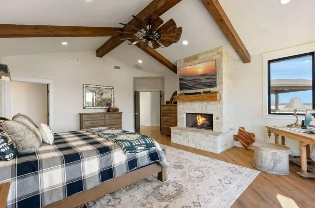 Hardwood furniture in a vaulted, beamed room