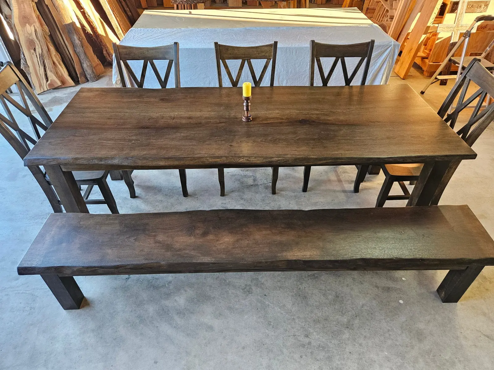 A live edge pecan dining table and bench in the shop